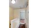 Upper level hallway with access to bedrooms and carpet flooring at 131 114Th Ne Ter # 131, St Petersburg, FL 33716