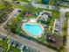 Community pool, playground, and parking lot at 131 114Th Ne Ter # 131, St Petersburg, FL 33716