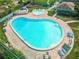 Aerial view of community pool, hot tub, and lounge area at 131 114Th Ne Ter # 131, St Petersburg, FL 33716