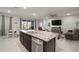 Modern kitchen with granite countertops and stainless steel appliances at 16784 Glacier Bay Loop, Wimauma, FL 33598