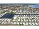 Wide aerial view of a mobile home community and nearby city at 18675 Us Highway 19 N # 488, Clearwater, FL 33764