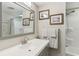 Clean bathroom with gray vanity, large mirror, and shower at 18675 Us Highway 19 N # 488, Clearwater, FL 33764