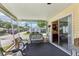Spacious screened porch with comfortable seating and access to the interior at 18675 Us Highway 19 N # 488, Clearwater, FL 33764