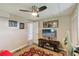 Bright office with a large TV, comfortable seating, and workspace at 18675 Us Highway 19 N # 488, Clearwater, FL 33764