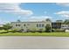 Side view of the home highlighting its features and landscaping at 18675 Us Highway 19 N # 488, Clearwater, FL 33764