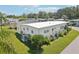 Front view of the home showcasing its design and landscaping at 18675 Us Highway 19 N # 488, Clearwater, FL 33764