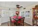 Cozy dining area with a wooden table and red chairs at 18675 Us Highway 19 N # 488, Clearwater, FL 33764