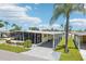 This charming single-wide home features a covered carport and landscaped yard at 18675 Us Highway 19 N # 488, Clearwater, FL 33764