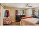 Comfortable bedroom with a dresser, chair, and window at 18675 Us Highway 19 N # 488, Clearwater, FL 33764