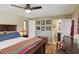 Bright bedroom with a comfortable bed, en-suite bathroom, and ceiling fan at 18675 Us Highway 19 N # 488, Clearwater, FL 33764