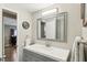 Modern bathroom with gray vanity and a large mirror at 18675 Us Highway 19 N # 488, Clearwater, FL 33764