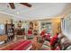 Open living area with leather couches and a view to dining area at 18675 Us Highway 19 N # 488, Clearwater, FL 33764
