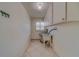 Laundry room with utility sink and upper cabinets at 2043 Imperial Way, Clearwater, FL 33764