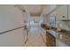 Galley kitchen with granite countertops and white cabinets at 2043 Imperial Way, Clearwater, FL 33764