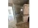 Walk-in shower displaying glass door and tile surround, connecting to bathroom at 239 Punta Vista Dr, St Pete Beach, FL 33706