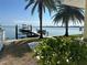 Private boat dock and lift with waterfront views at 239 Punta Vista Dr, St Pete Beach, FL 33706