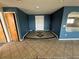 Entryway featuring tile floors, blue walls, and a mirror at 239 Punta Vista Dr, St Pete Beach, FL 33706