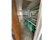 Small bathroom with teal vanity and tiled floors at 239 Punta Vista Dr, St Pete Beach, FL 33706