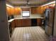 Kitchen with wood cabinets and stainless steel appliances at 2815 Kebs Ln, Plant City, FL 33565