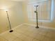 Empty bedroom with tile floor and window at 3038 Eastland Blvd # F102, Clearwater, FL 33761