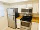 Modern kitchen with stainless steel appliances at 3038 Eastland Blvd # F102, Clearwater, FL 33761