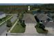 Aerial view of a house with a three-car garage at 4077 Broad Porch Run, Land O Lakes, FL 34638