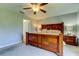 Spacious bedroom with large bed and ceiling fan at 5220 Butterfly Shell Dr, Apollo Beach, FL 33572