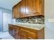 Well-equipped kitchen with wood cabinets and granite countertops at 5220 Butterfly Shell Dr, Apollo Beach, FL 33572