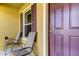 Inviting front porch with two chairs and a view of the front door at 5220 Butterfly Shell Dr, Apollo Beach, FL 33572