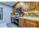 Modern kitchen with stainless steel appliances and granite countertops at 5220 Butterfly Shell Dr, Apollo Beach, FL 33572