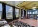 Entertainment sunroom with a large TV and comfortable furnishings at 5220 Butterfly Shell Dr, Apollo Beach, FL 33572