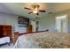 Bedroom with large bed and en-suite bathroom at 5220 Butterfly Shell Dr, Apollo Beach, FL 33572