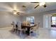 Elegant dining room with a large table and access to kitchen at 5220 Butterfly Shell Dr, Apollo Beach, FL 33572