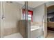 Bathroom with shower, bathtub, and updated fixtures at 5220 Butterfly Shell Dr, Apollo Beach, FL 33572