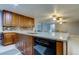 Kitchen with dishwasher and granite countertops at 5220 Butterfly Shell Dr, Apollo Beach, FL 33572