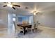 Bright dining room with hardwood floors and view of kitchen at 5220 Butterfly Shell Dr, Apollo Beach, FL 33572