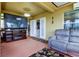 Spacious sunroom, with fireplace and access to the kitchen at 5220 Butterfly Shell Dr, Apollo Beach, FL 33572