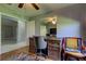 Home office features built-in desk and chair, hardwood floors at 5220 Butterfly Shell Dr, Apollo Beach, FL 33572