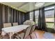 Sunroom dining area with table and chairs, screened windows at 5220 Butterfly Shell Dr, Apollo Beach, FL 33572