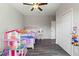 Bright bedroom with double closets and wood-look floors at 5369 Boxtree Ct, Dade City, FL 33523