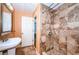 Bathroom with a shower, sink and a door to another room at 1126 60Th S St, Gulfport, FL 33707