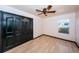 Bright bedroom with hardwood floors and black closet doors at 1126 60Th S St, Gulfport, FL 33707