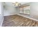 Bright dining area with wood-look floors and a window with blinds at 2063 Dawn Dr, Clearwater, FL 33763