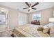 Bedroom with a queen bed, neutral walls, and wood-look flooring at 2351 Mangrum Dr, Dunedin, FL 34698