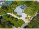 Aerial view of house, pool, and expansive lot at 2420 Kent Pl, Clearwater, FL 33764