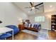 Bright bedroom with hardwood floors, built in shelving and window at 2420 Kent Pl, Clearwater, FL 33764