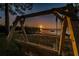 Wooden swing overlooking the water at sunset at 2700 Bayshore Blvd # 9104, Dunedin, FL 34698