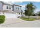 Attached garage with driveway and landscaping at 2704 W Fig St # 1, Tampa, FL 33609