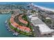 Wide aerial showcasing the community near the beach and waterway at 4630 Mirabella Ct, St Pete Beach, FL 33706