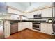Modern kitchen featuring granite countertops and stainless steel appliances at 4630 Mirabella Ct, St Pete Beach, FL 33706